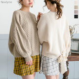 バックシャンスリットリボンケーブルニットトップス