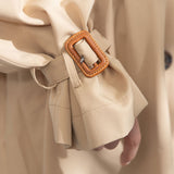 バックプリーツショートトレンチコート