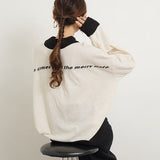 ハイネックバックロゴニットトップス