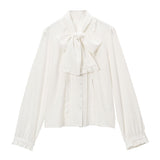 大きなボウタイフリルブラウス
