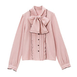 大きなボウタイフリルブラウス