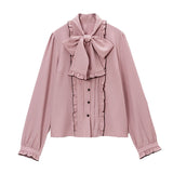 大きなボウタイフリルブラウス