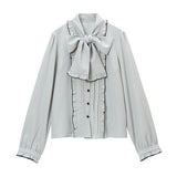 大きなボウタイフリルブラウス