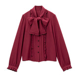 大きなボウタイフリルブラウス