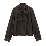 大きなボウタイフリルブラウス