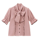 大きなボウタイフリルブラウス